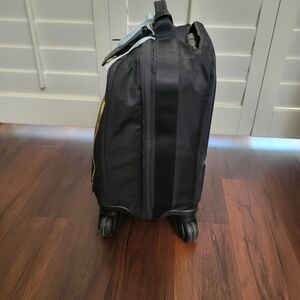 Tumi Black and Gold Rolling Travel Bag